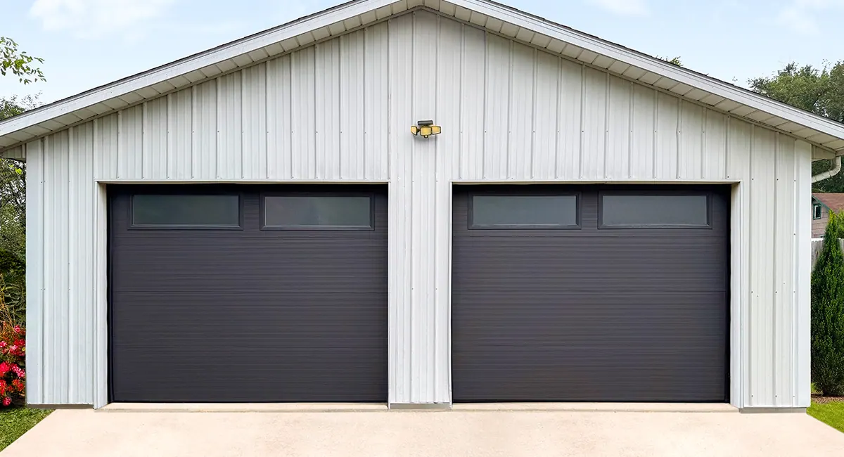 dark bronze garage doors on white garage