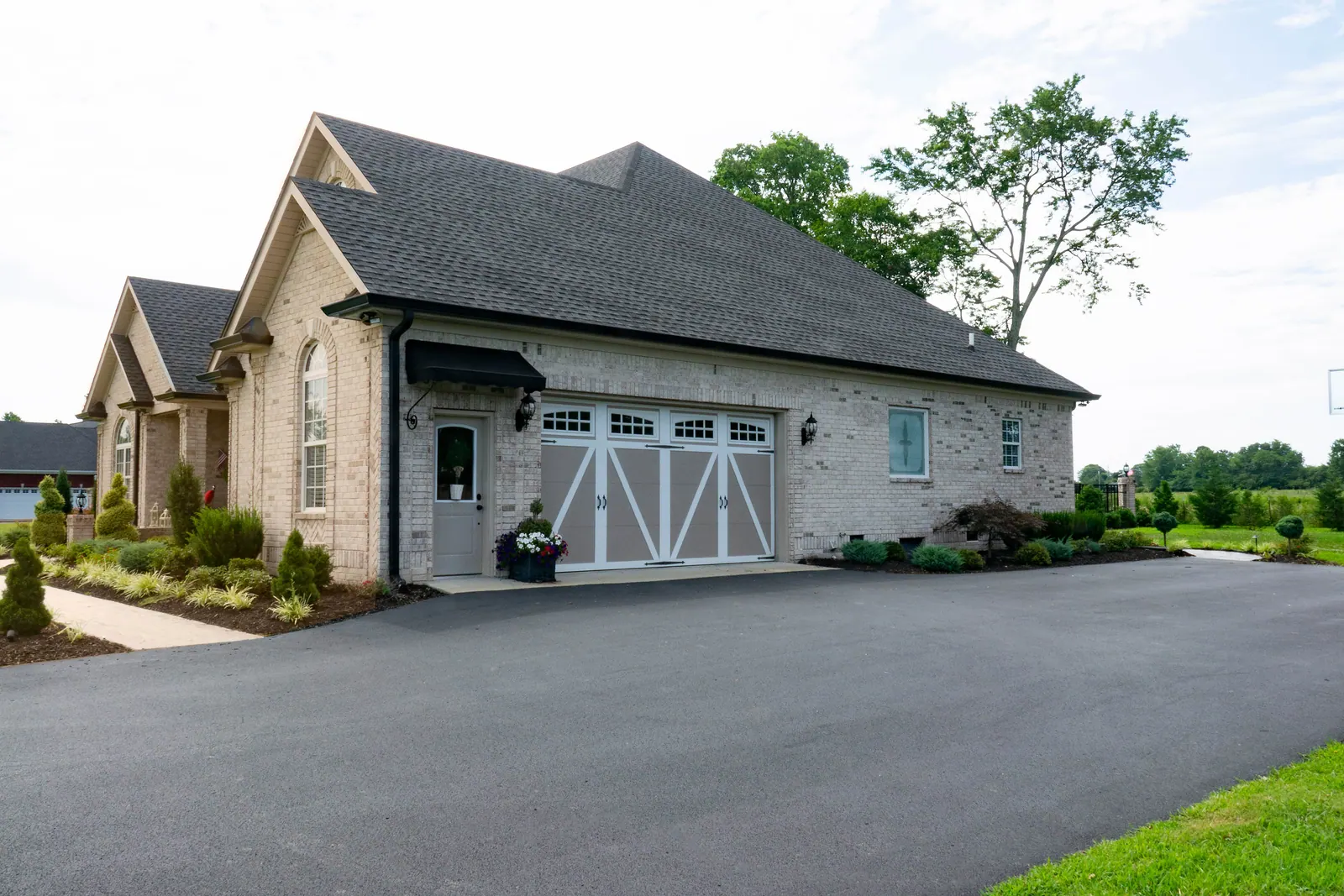 Aristocrat Presidential doors on a long brick ranch elevation
