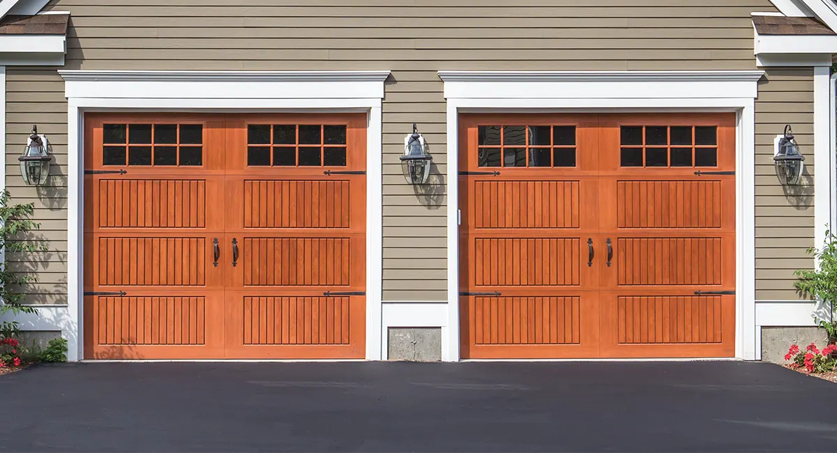 two cherry fiberglass garage doors with sixteen square windows