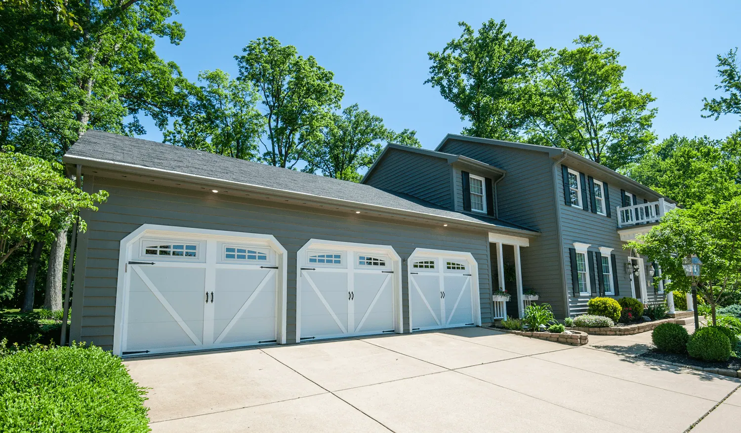 Safe-Way Aristocrat carriage doors across a three-car garage